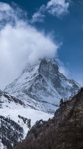 Preview wallpaper rock, mountain, snow, snowy, clouds