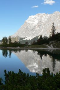 Preview wallpaper rock, mountains, lake, reflection, mirror, shade, trees