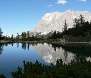 Preview wallpaper rock, mountains, lake, reflection, mirror, shade, trees