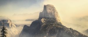 Preview wallpaper rock, mountains, peak, fog, nature