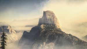 Preview wallpaper rock, mountains, peak, fog, nature