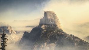 Preview wallpaper rock, mountains, peak, fog, nature