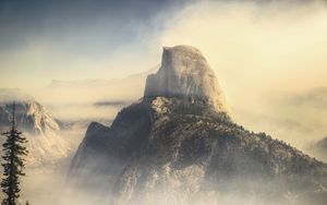 Preview wallpaper rock, mountains, peak, fog, nature