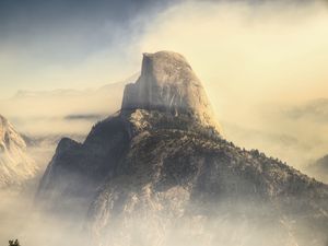Preview wallpaper rock, mountains, peak, fog, nature