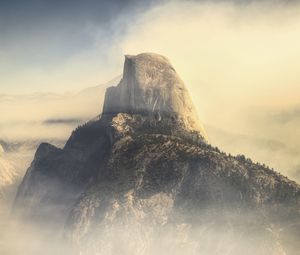 Preview wallpaper rock, mountains, peak, fog, nature