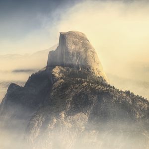 Preview wallpaper rock, mountains, peak, fog, nature