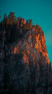 Preview wallpaper rock, mountains, peak, trees, sky