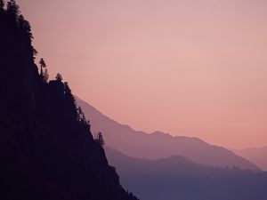 Preview wallpaper rock, mountains, trees, evening, cliff