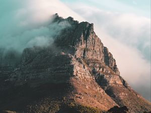 Preview wallpaper rock, peak, cloud, fog