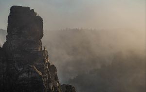 Preview wallpaper rock, peak, fog, trees, landscape