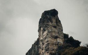 Preview wallpaper rock, peak, mountain, trees, nature