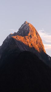 Preview wallpaper rock, peak, mountains, snow, snowy, sky