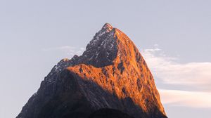 Preview wallpaper rock, peak, mountains, snow, snowy, sky