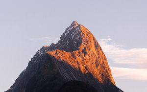 Preview wallpaper rock, peak, mountains, snow, snowy, sky