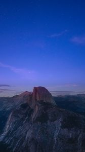 Preview wallpaper rock, peak, mountains, sunset, clouds