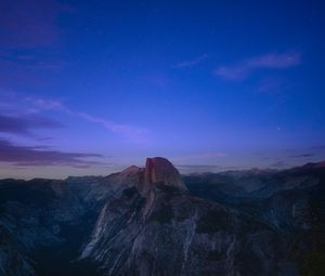 Preview wallpaper rock, peak, mountains, sunset, clouds