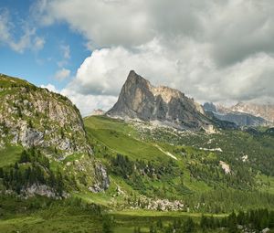 Preview wallpaper rock, peak, slope, grass, clouds