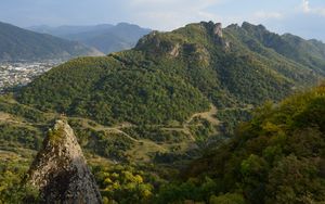 Preview wallpaper rock, peak, valley, hills, view, nature