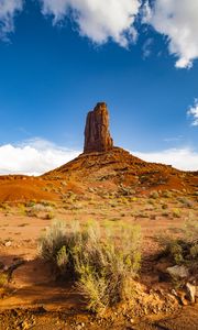 Preview wallpaper rock, prairie, bushes, sand, sky