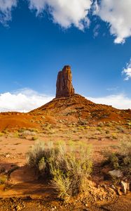 Preview wallpaper rock, prairie, bushes, sand, sky