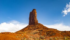 Preview wallpaper rock, prairie, bushes, sand, sky