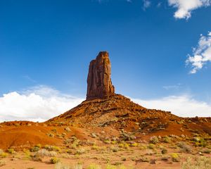 Preview wallpaper rock, prairie, bushes, sand, sky