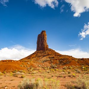 Preview wallpaper rock, prairie, bushes, sand, sky