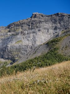 Preview wallpaper rock, relief, slope, grass, landscape