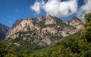 Preview wallpaper rock, relief, trees, clouds, nature