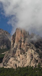 Preview wallpaper rock, relief, trees, clouds, view