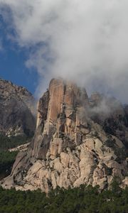 Preview wallpaper rock, relief, trees, clouds, view