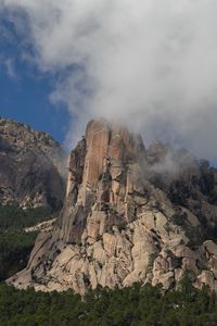 Preview wallpaper rock, relief, trees, clouds, view