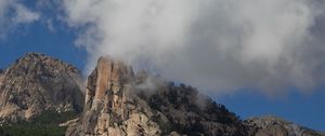 Preview wallpaper rock, relief, trees, clouds, view