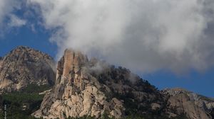 Preview wallpaper rock, relief, trees, clouds, view