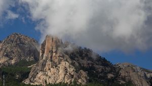 Preview wallpaper rock, relief, trees, clouds, view