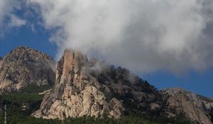 Preview wallpaper rock, relief, trees, clouds, view