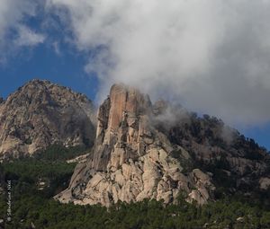 Preview wallpaper rock, relief, trees, clouds, view