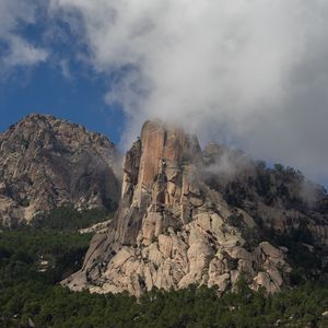 Preview wallpaper rock, relief, trees, clouds, view