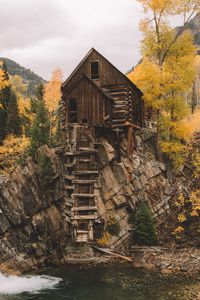 Preview wallpaper rock, river, house, wooden, nature