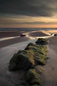 Preview wallpaper rock, sand, sunset, aerial view, landscape