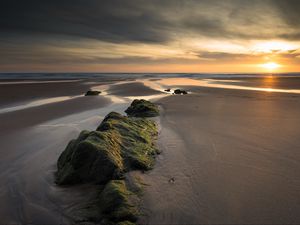 Preview wallpaper rock, sand, sunset, aerial view, landscape