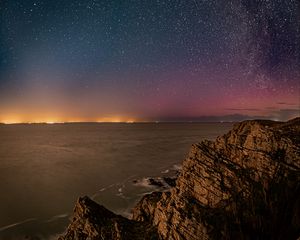 Preview wallpaper rock, sea, milky way, stars, night