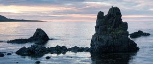 Preview wallpaper rock, sea, silhouette, nature, evening