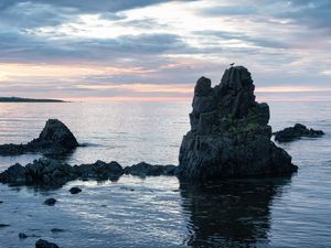 Preview wallpaper rock, sea, silhouette, nature, evening