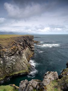 Preview wallpaper rock, sea, stones, landscape, nature, clouds