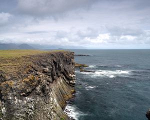 Preview wallpaper rock, sea, stones, landscape, nature, clouds