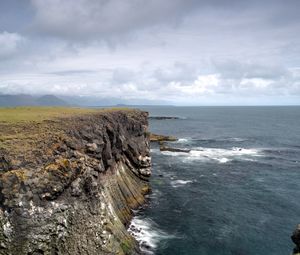 Preview wallpaper rock, sea, stones, landscape, nature, clouds