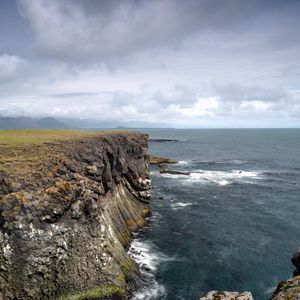 Preview wallpaper rock, sea, stones, landscape, nature, clouds