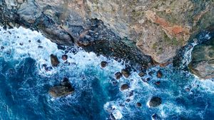 Preview wallpaper rock, sea, stones, aerial view