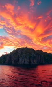 Preview wallpaper rock, sea, sunset, sky, clouds
